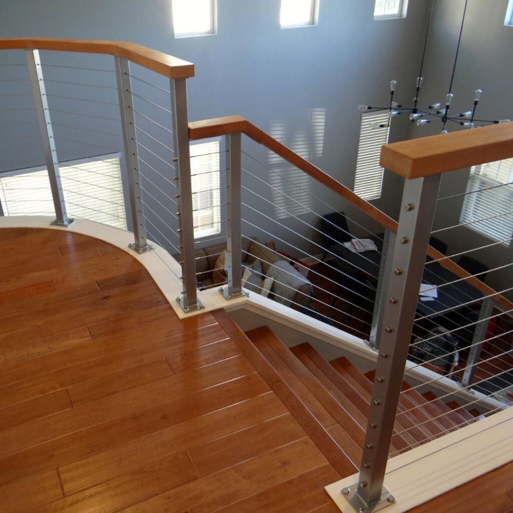 Detailed view of high-quality stainless steel cable railing hardware and tensioners.