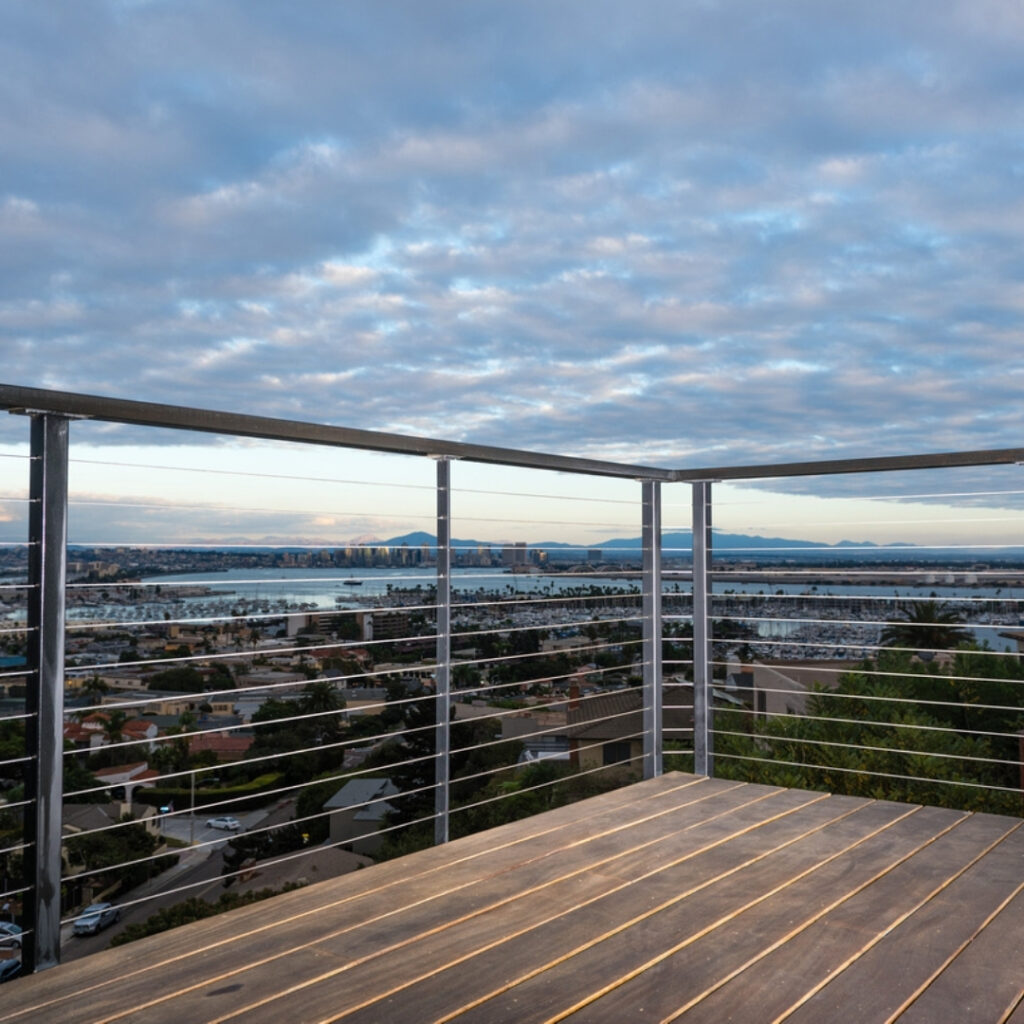 Stainless steel railings along a space overlooking the city