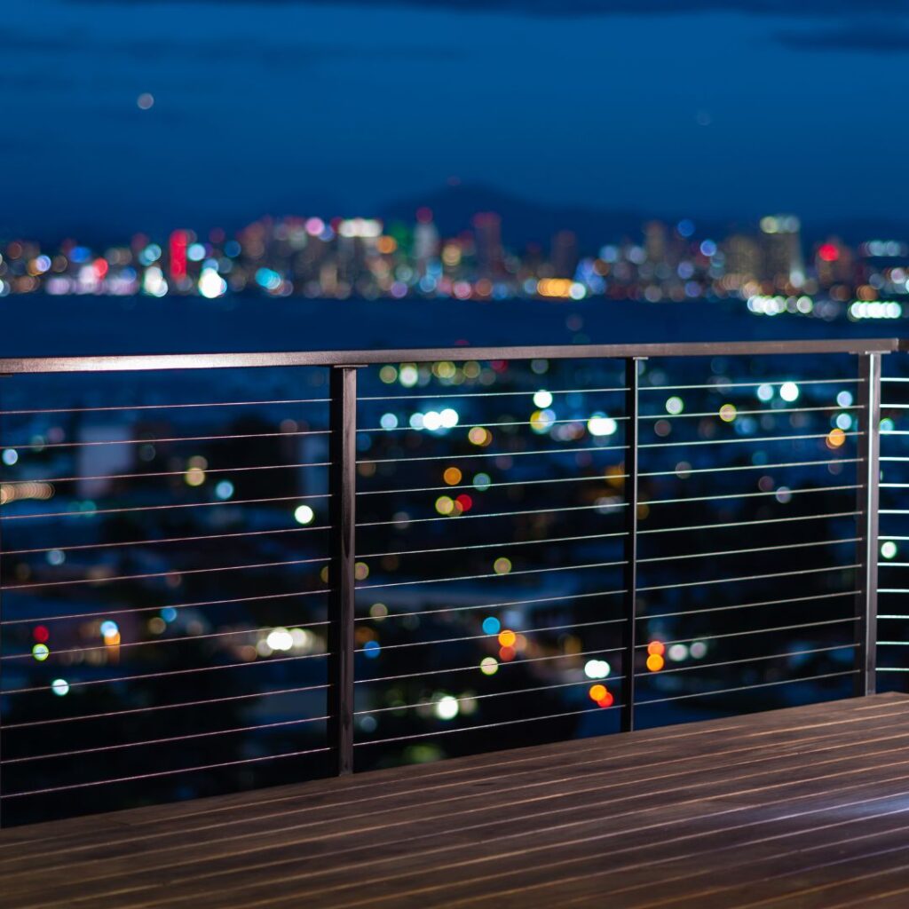 Deck railing at night,