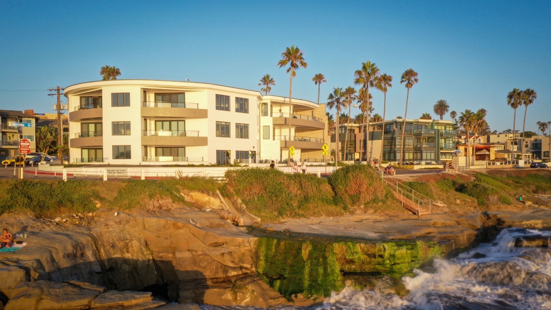 coastal view of a property with glass railings